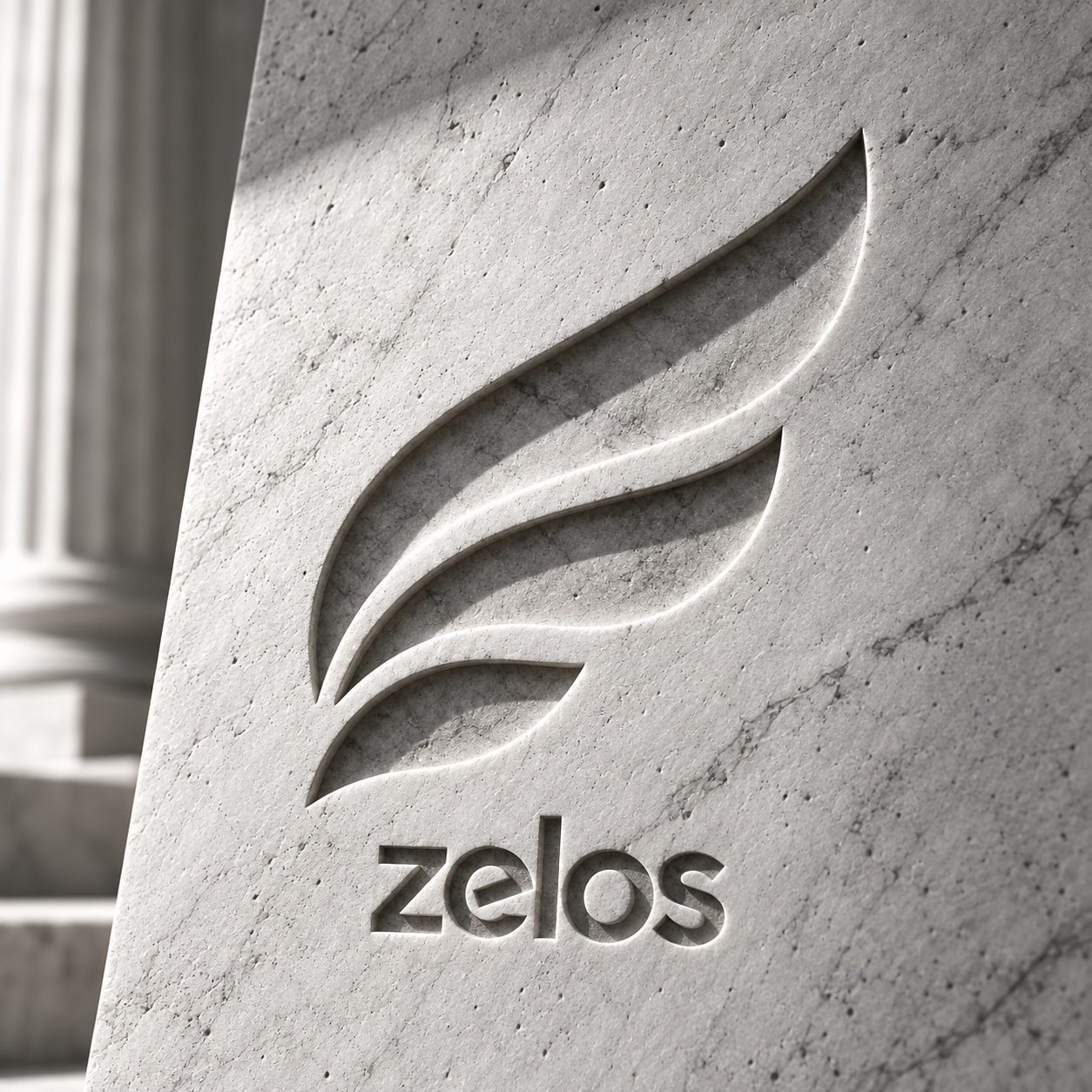 The Zelos wing and lowercase wordmark carved into pale stone beside a Greek column.